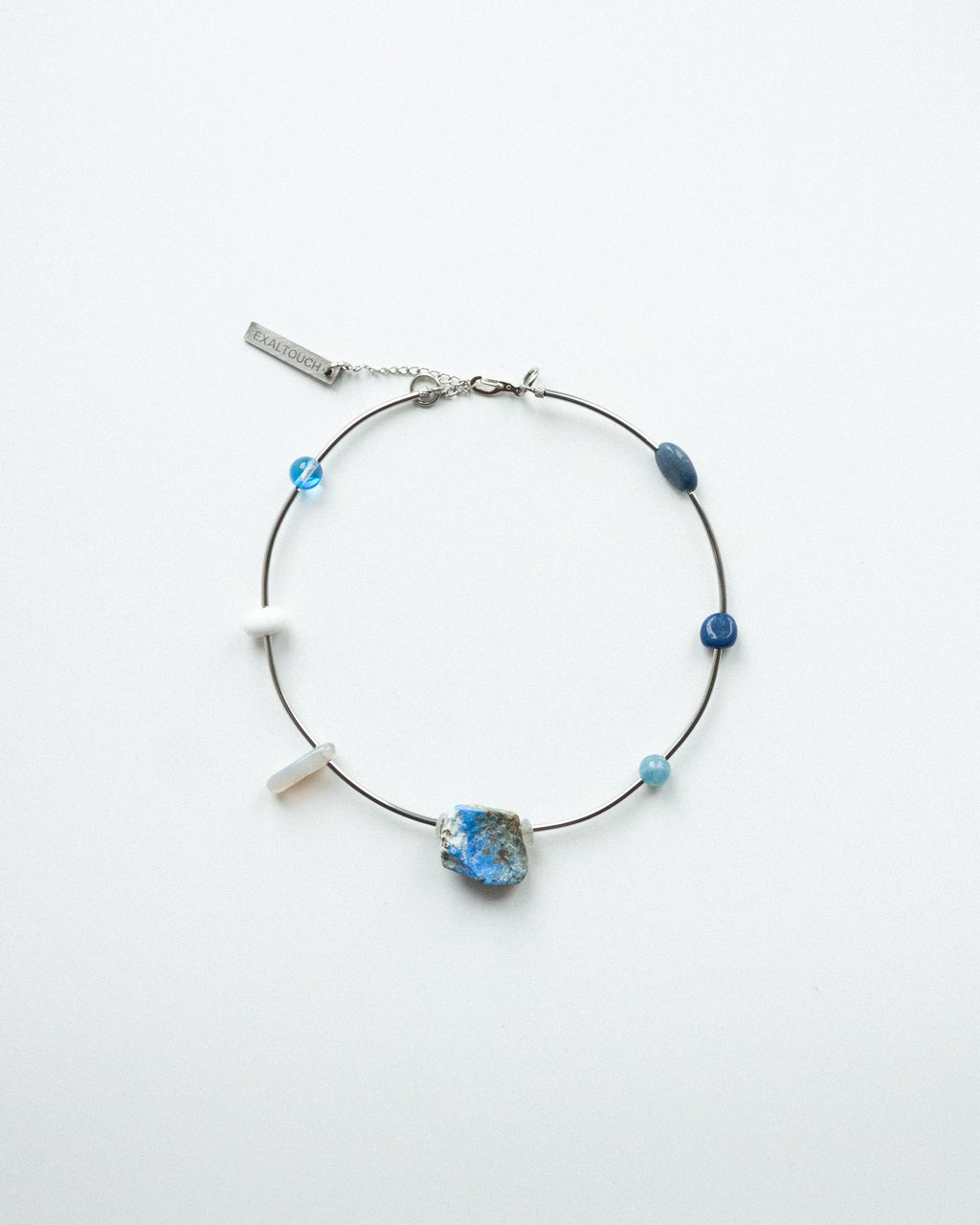 Necklace with blue beads on a white background